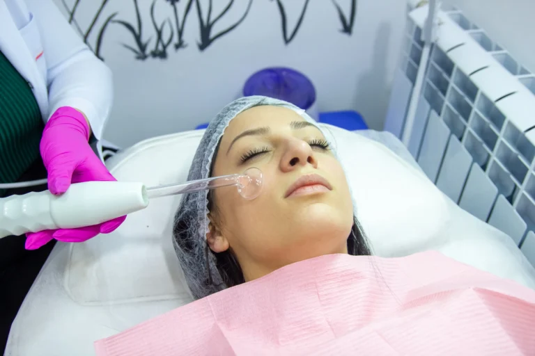 a women undergoing hydrafacial treatment in calicut